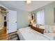 Serene bedroom with a neutral color palette and warm wood flooring at 4844 Vallejo St, Denver, CO 80221