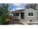 Well-maintained home features manicured front yard, landscaping, and charming curb appeal at 4844 Vallejo St, Denver, CO 80221