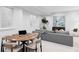 Cozy finished basement featuring a comfortable gray sofa and a round poker table, perfect for relaxation at 421 S Pearl St, Denver, CO 80209