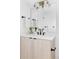 Bright bathroom featuring a modern vanity, marble countertops, stylish mirror and contemporary lighting fixtures at 421 S Pearl St, Denver, CO 80209