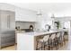 Modern kitchen with a large island, stainless steel appliances, and white cabinetry at 421 S Pearl St, Denver, CO 80209