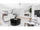 Open-concept living room with fireplace, modern furniture, and plenty of natural light at 421 S Pearl St, Denver, CO 80209