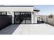 Spacious rooftop deck with gray tiled flooring and modern railing, perfect for outdoor entertaining and relaxation at 421 S Pearl St, Denver, CO 80209