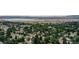 Real estate showcasing a residential neighborhood with lush trees and scenic views at 8160 W Phillips W Ave, Littleton, CO 80128