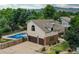 Home boasts a private backyard with a sparkling in-ground swimming pool at 8160 W Phillips W Ave, Littleton, CO 80128