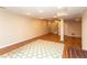 Finished basement features a large rec room with stylish carpeting and recessed lighting at 8160 W Phillips W Ave, Littleton, CO 80128
