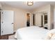 Bedroom features natural light, ceiling fan, closet, and ensuite bathroom at 8160 W Phillips Ave, Littleton, CO 80128