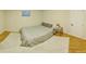 Finished basement bedroom with light wood floors and a closet. Bright natural light from the window at 8160 W Phillips W Ave, Littleton, CO 80128