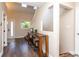 Bright entryway with hardwood floors, skylights, and stylish console table at 8160 W Phillips W Ave, Littleton, CO 80128