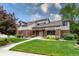 Charming home featuring manicured lawn and mature trees under a bright sky at 8160 W Phillips W Ave, Littleton, CO 80128