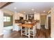 Bright kitchen with a center island, stylish tile backsplash, and stainless steel appliances at 8160 W Phillips W Ave, Littleton, CO 80128