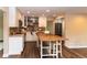 A modern kitchen with sleek white cabinetry, stylish island, and stainless steel appliances at 8160 W Phillips W Ave, Littleton, CO 80128