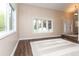 Inviting living room with large windows, hardwood floors, and ample natural light at 8160 W Phillips W Ave, Littleton, CO 80128