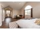 Comfortable main bedroom features vaulted ceiling, a large window, and a relaxing sitting area at 8160 W Phillips W Ave, Littleton, CO 80128