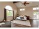 Bright main bedroom with vaulted ceiling, ceiling fan, large window, and glass door to backyard at 8160 W Phillips W Ave, Littleton, CO 80128