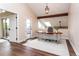 Bright office featuring wood floors, a skylight, desk, and glass doors to the outside deck at 8160 W Phillips W Ave, Littleton, CO 80128
