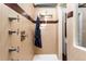 Spa-like shower with multiple shower heads, modern tile, and a glass enclosure at 8160 W Phillips W Ave, Littleton, CO 80128