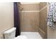Shower features tiled walls, a rainfall shower head, and a built-in seat at 8160 W Phillips W Ave, Littleton, CO 80128