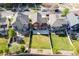 Aerial view of a two-story home with a well-maintained backyard and neighboring houses at 10778 Dayton Way, Commerce City, CO 80640