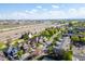 Neighborhood aerial view, showing proximity to highway and Denver city in the distance at 10778 Dayton Way, Commerce City, CO 80640