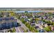 Aerial view of a residential neighborhood near a lake, showcasing its community and surroundings at 10778 Dayton Way, Commerce City, CO 80640