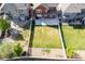 Expansive backyard featuring a large grassy area and a concrete patio perfect for entertaining at 10778 Dayton Way, Commerce City, CO 80640