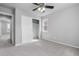This bedroom features neutral walls, carpet, a ceiling fan, a window, and closet with a double door at 10778 Dayton Way, Commerce City, CO 80640