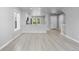 Bright and spacious living room with hardwood flooring and modern finishes throughout the open-concept space at 10778 Dayton Way, Commerce City, CO 80640