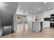 Open living room with modern finishes, hardwood floors, recessed lighting, and neutral paint colors at 10778 Dayton Way, Commerce City, CO 80640