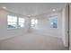 Bright bedroom with three large windows offering great natural light and neutral carpeting at 23921 E 40 Th Ave, Aurora, CO 80019