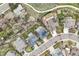 An aerial view of a residential area with sidewalks, green spaces, homes with solar panels, and beautiful surroundings at 5986 Dunraven Ct, Golden, CO 80403