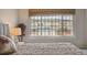 Cozy bedroom offering scenic views, a comfortable bed, and a peaceful atmosphere, perfect for restful nights and relaxation at 5986 Dunraven Ct, Golden, CO 80403