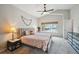 Serene bedroom with vaulted ceilings, a comfortable bed, and a large window offering natural light and a calming view at 5986 Dunraven Ct, Golden, CO 80403