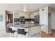 Modern kitchen features a center island, sleek stainless steel appliances, and stylish cabinets at 5986 Dunraven Ct, Golden, CO 80403