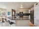 Modern kitchen features a center island, sleek stainless steel appliances, and stylish cabinets at 5986 Dunraven Ct, Golden, CO 80403