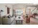 Cozy living room with vaulted ceilings, natural light, and comfortable seating at 5986 Dunraven Ct, Golden, CO 80403