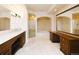 Spacious bathroom with double vanity, a soaking tub, glass shower and vanity area at 8100 E Union Ave # 2201, Denver, CO 80237