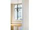 Hallway displaying hardwood floors, natural light from a large window, modern chandelier and easy access to other rooms at 8100 E Union Ave # 2201, Denver, CO 80237