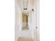 Hallway features white columns, archways, carpet flooring and decorative wall lighting at 8100 E Union Ave # 2201, Denver, CO 80237
