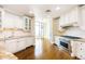 Bright kitchen boasts stainless steel appliances, granite counters, custom cabinetry and hardwood floors at 8100 E Union Ave # 2201, Denver, CO 80237