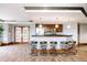 Kitchen and entertaining area featuring a bar counter with chairs at 8100 E Union Ave # 2201, Denver, CO 80237