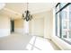 Spacious living area features modern lighting and natural light from large windows and classic architectural design at 8100 E Union Ave # 2201, Denver, CO 80237