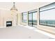Spacious living room with large windows offering city views, a fireplace, and ample natural light at 8100 E Union Ave # 2201, Denver, CO 80237