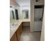 Functional bathroom with vanity, sink, and in-unit washer/dryer at 9262 E Arbor Cir # H, Englewood, CO 80111