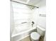 A clean, white bathtub and toilet in a well-maintained bathroom at 9262 E Arbor Cir # H, Englewood, CO 80111