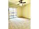 Bedroom with carpet, ceiling fan and sliding glass doors to the outside at 9262 E Arbor Cir # H, Englewood, CO 80111