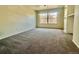 Sunlit bedroom with carpet, a large window, and ample natural light at 9262 E Arbor Cir # H, Englewood, CO 80111