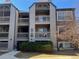 Exterior view of condo building with stone accents and multiple balconies at 9262 E Arbor Cir # H, Englewood, CO 80111