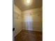 A walk-in closet with ventilated shelving and neutral carpet and paint at 9262 E Arbor Cir # H, Englewood, CO 80111