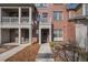 Charming brick townhome featuring a well-maintained front walkway and a cozy entrance at 755 Roslyn St # 17, Denver, CO 80230